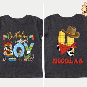 The image is a birthday t-shirt featuring a cartoon character and the name "Nicolas" printed on it.