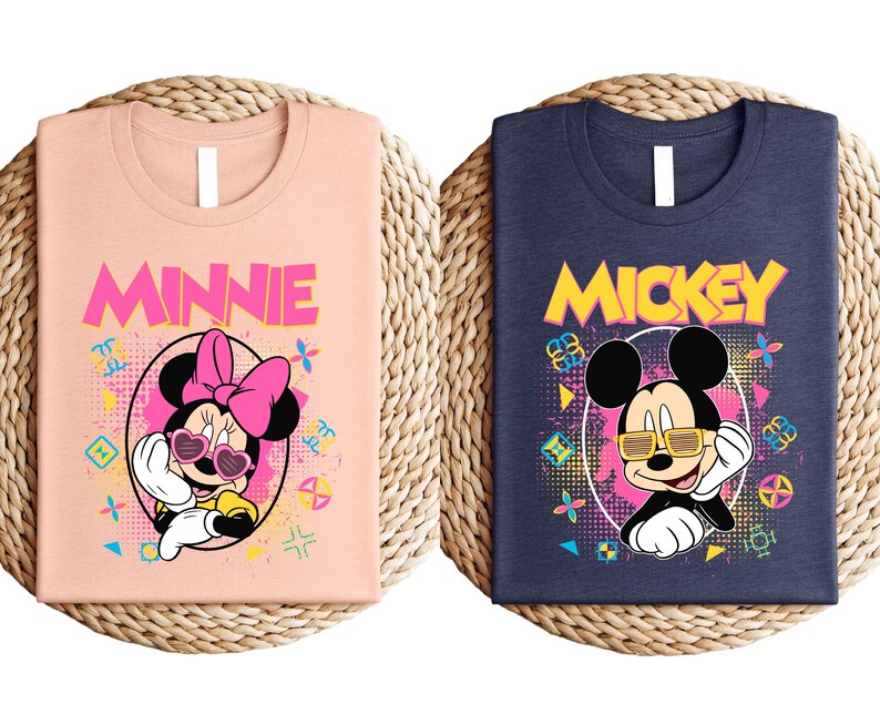 two t-shirts with the characters Minnie Mouse and Mickey Mouse printed on them.