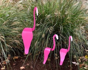 Hot Pink Flamingo Family SET of 3. They twirl and bob and spin around with the slightest garden breeze. Eye catching in any outdoor setting.