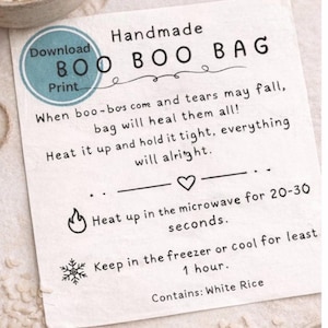 May include: A handmade "BOO BOO BAG" card with instructions. The card features text in black, including "When boo-bos come and tears may fall, bag will heal them all!" and instructions for heating in the microwave or cooling in the freezer. White rice is listed as the contents.
