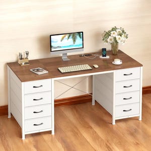 May include: A two-tone computer desk with a brown wooden top and white drawers. The desk has a monitor, keyboard, and mouse on top, along with a vase of flowers and a coffee cup. The desk has six drawers and a metal frame.