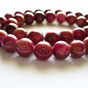 Perles de jade rondes rouges et roses 10 mm