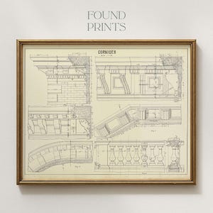 May include: Framed architectural blueprint print featuring detailed drawings of cornices. The print is in sepia tones with the text "FOUND PRINTS" at the top and "CORNICES" at the center. The frame is a warm gold color.