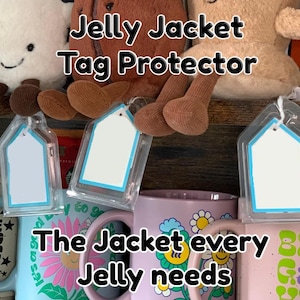 May include: Clear plastic tag protectors with a blue border and white insert, hanging in front of colourful mugs and plush toys. The text "Jelly Jacket Tag Protector" and "The Jacket every Jelly needs" are visible.