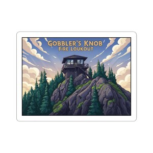 May include: A sticker featuring a scenic illustration of Gobbler's Knob Fire Lookout. The artwork depicts a wooden fire tower atop a rocky mountain, surrounded by evergreen trees, under a cloudy sky. The text "GOBBLER'S KNOB FIRE LOUKOUT" is arched above the tower.