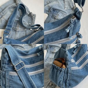 May include: A blue denim shoulder bag featuring multiple zippered compartments, a wide adjustable strap with silver-toned metal hardware, and an exterior side pocket with an elasticized opening. The bag has a textured fabric finish and frayed detailing.