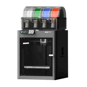 May include: A 3D printer with a black and gray exterior, featuring a clear top section holding multiple spools of filament in white, green, blue, and red. The printer has a digital display and the brand name "Bambu Lab" is visible.