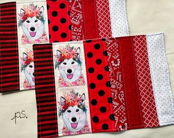 Happy Huskie in Crown of Flowers and Floral Clothes vs Christmas Dogs Playing in the Snow Placemats - Reversible Dogs Quilted Placemat Pair