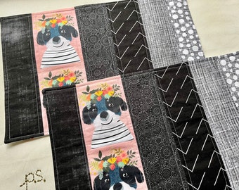 Black and White Dog with Crown of Flowers vs Christmas Dogs Playing in the Snow Placemats - Reversible Dogs Quilted Placemat Pair