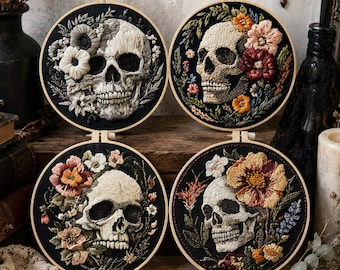May include: Four circular embroidery hoops featuring detailed thread-stitched human skulls on black fabric. Each skull is surrounded by colourful floral arrangements in shades of white, pink, red, orange, and yellow, framed by wooden hoops.