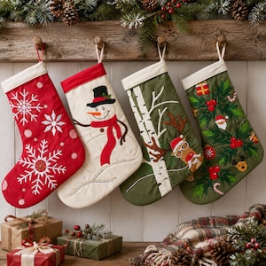 May include: Four holiday stockings hanging from a wooden rack. The first is red with white embroidered snowflakes. The second is cream with a snowman wearing a black hat and red scarf. The third is olive green with birch trees and a reindeer. The fourth is dark green with holly, berries, and small gift icons.