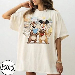 May include: A set of three ceramic mugs with a speckled, matte finish. The mugs are in shades of cream, light gray, and dark gray. Each mug has a simple, minimalist design, perfect for coffee or tea.