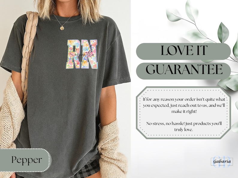 May include: Dark gray t-shirt with the letters "RN" in a floral design and the name "Samantha" in script. The shirt has a relaxed fit and is made of a soft material. The word "Pepper" is at the bottom.
