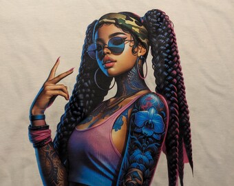 May include: White t-shirt featuring a vibrant illustration of a woman with long, braided hair, sunglasses, and tattoos. The artwork includes a pink and blue color scheme, with a peace sign gesture.