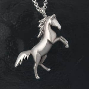 horse pendant .  silver