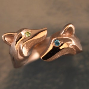 double fox ring.  14 k gold , diamond eyes