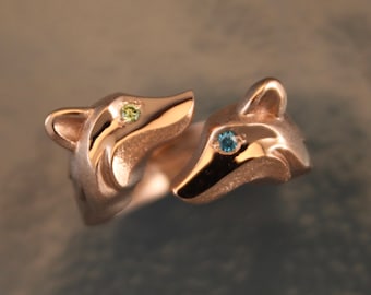 double fox ring.  14 k gold , diamond eyes