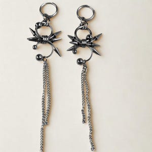 punk rivet chainmail earrings close up – grunge metal fashion accessory