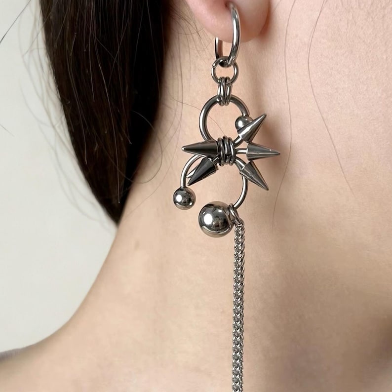 punk girl wearing chain spike earrings – alternative fashion jewelry