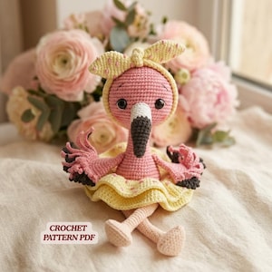 May include: A handmade pink crochet flamingo doll with a yellow bow and skirt. The flamingo has a black and white beak and is sitting with its legs extended. The text "CROCHET PATTERN PDF" is visible.