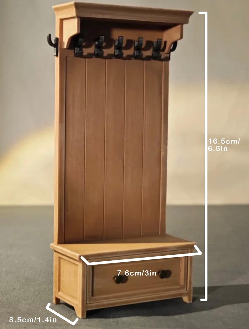 May include: A miniature wooden hall tree with a bench, drawer, and coat hooks. The hall tree is 6.5 inches tall, 3 inches wide, and 1.4 inches deep. It features a light brown finish and is designed for dollhouses or miniature settings.