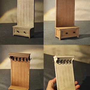 May include: A miniature wooden hall tree with a bench, drawer, and coat hooks. The light-colored wood has a vertical plank design on the back panel. The bench has a drawer with two round knobs. The coat hooks are black.