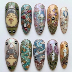 May include: A set of ten intricately designed nail art pieces. Each nail features a different design, including Totoro, berries, koi fish, flowers, and a hot air balloon. The nails are oval-shaped with a glossy finish and detailed artwork.