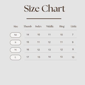 May include: A size chart with the title "Size Chart" in a serif font. The chart lists sizes XS, S, M, and L, with corresponding measurements for thumb, index, middle, ring, and little fingers. The background is a light beige.