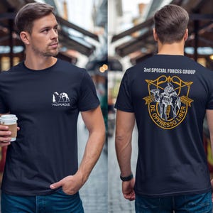 Navy t-shirt with "Nomads" logo on front, and "3rd Special Forces Group" insignia on back.