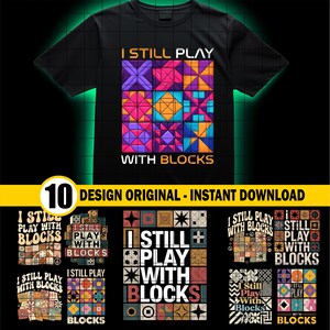 May include: Black t-shirt with the text "I STILL PLAY WITH BLOCKS" and a colourful geometric design. The design features various shapes and colours, including purple, orange, and blue. The image also includes 10 design options.