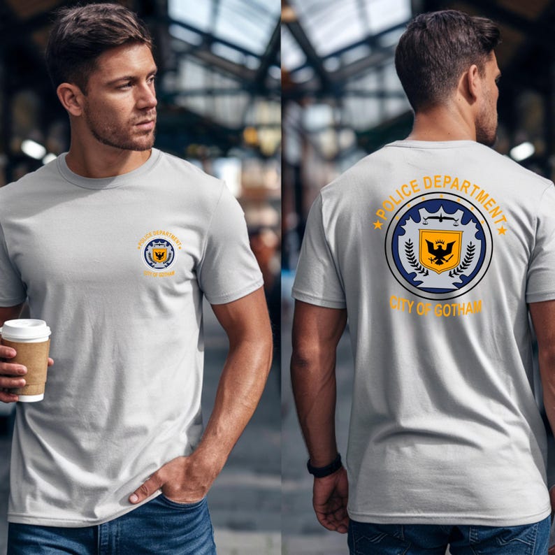 Man wearing light grey t-shirt with "Police Department City of Gotham" logo on back.