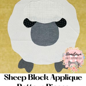 Op de afbeelding: Een wit schapen applique-patroon met zwarte stippen op de oren en een grijs gezicht. Het patroon is op een gele achtergrond met de tekst "Sheep Block Applique Pattern Pieces" en een logo voor "Hometown Quilt Company, LLC".