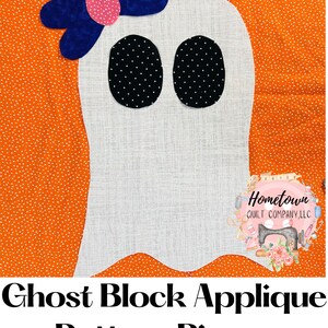 May include: A white ghost applique pattern piece with black eyes and a blue bow with a pink centre. The pattern piece is on an orange background with white polka dots. The text "Hometown Quilt Company, LLC" is in the bottom right corner of the image. The text "Ghost Block Applique Pattern Pieces" is at the bottom of the image.