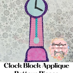 May include: Applique pattern pieces for a clock block quilt. The clock face is light blue with a black hand, the body is pink with a purple trim, and the pendulum is turquoise with white polka dots.