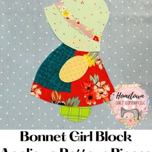 May include: Applique pattern pieces for a bonnet girl block. The design features a light green bonnet with a floral patterned band, a teal top, and a red floral skirt. The background is light blue with white polka dots.