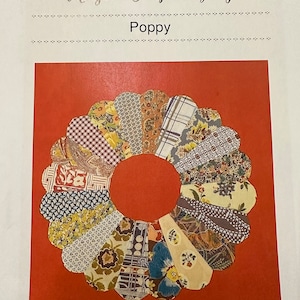 May include: A colorful fabric poppy flower with a red background. The title "Take an Element" and the name "Margaret Sampson George" are printed above the flower. The word "Poppy" is printed below the flower.