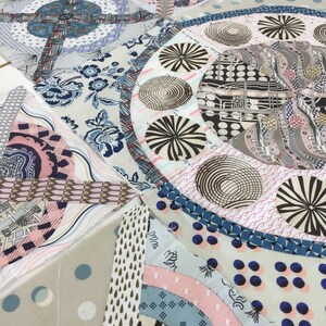 May include: A close-up of a quilt made of various fabrics with different patterns. The quilt is made up of many different shapes and sizes, and the fabrics are all different colors. The quilt is a patchwork of different fabrics, and the colors are bright and vibrant.