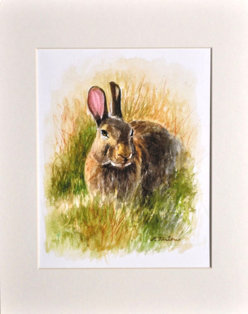 May include: Watercolor painting of a brown rabbit with pink ears sitting in a field of green grass.