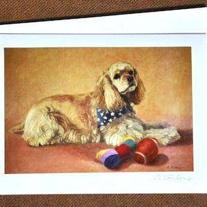 May include: A painting of a golden cocker spaniel dog with a red, white, and blue bandana lying on a red-brown surface with two colorful toys. The dog is looking at the viewer. The painting is signed "D. Taylor" in the bottom right corner.