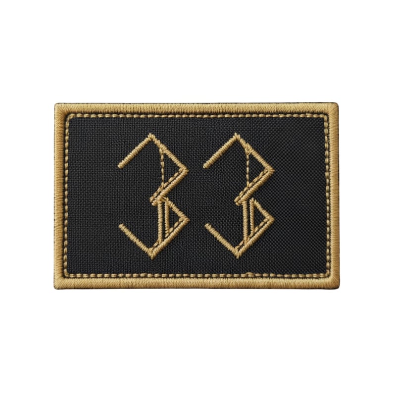 May include: Black rectangular patch with the number "33" embroidered in gold thread. The patch has a gold border and a textured appearance. The number is stylized with angular lines.