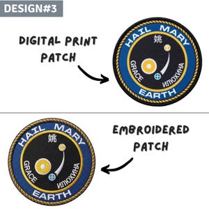 May include: Two circular patches with a blue and gold design. The top patch is a digital print, and the bottom is embroidered. Both patches feature the words "HAIL MARY", "GRACE", "EARTH", and text in another language. The patches have a gold rope border.