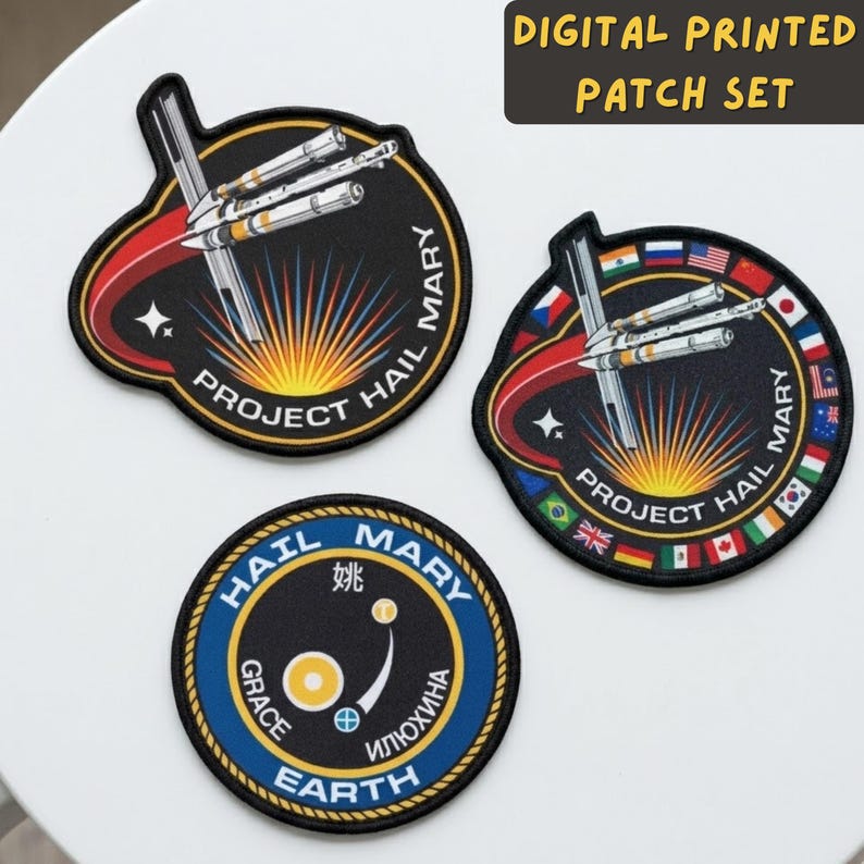 May include: A set of three digital printed patches. Two patches feature a spacecraft design with the text "PROJECT HAIL MARY" and "HAIL MARY". The third patch has the text "HAIL MARY", "GRACE EARTH", and text in another language.
