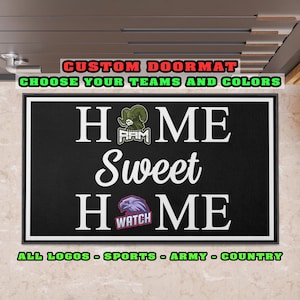 May include: Black rectangular doormat with white border. The words "HOME Sweet HOME" are in white, with team logos. Text at the top says "CUSTOM DOORMAT CHOOSE YOUR TEAMS AND COLORS". Text at the bottom says "ALL LOGOS - SPORTS - ARMY - COUNTRY".