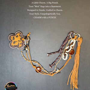 May include: A collection of bag charms with various designs and textures. One charm features a brown and tan animal print flower shape. Other charms include chains, beads, and a tassel. The text reads: "A Little Charm. A Big Punch."
