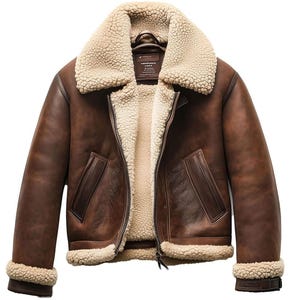 May include: A brown leather jacket with a cream-colored shearling collar and lining. The jacket features a zip-up front, two front pockets, and shearling trim on the cuffs and hem. The jacket has a classic aviator style.