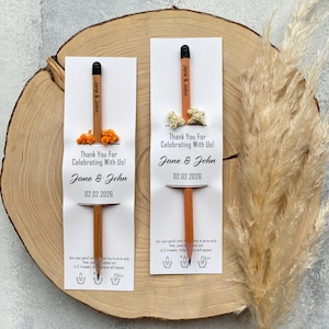 There are flowers and a pencil with seeds on the card.