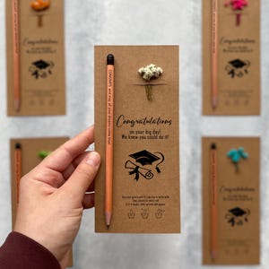 There are flowers and a pencil with seeds on the card.