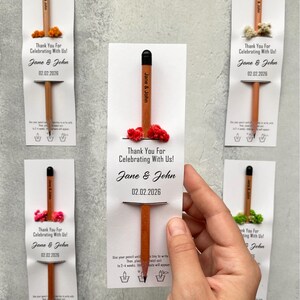 There are flowers and a pencil with seeds on the card.