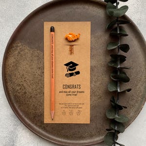 There are flowers and a pencil with seeds on the card.