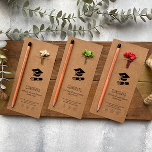 There are flowers and a pencil with seeds on the card.